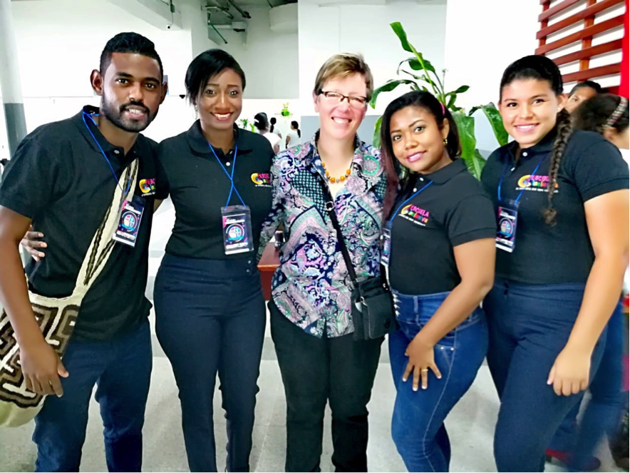 Photograph showing Jutta standing together with some of the teachers and smiling